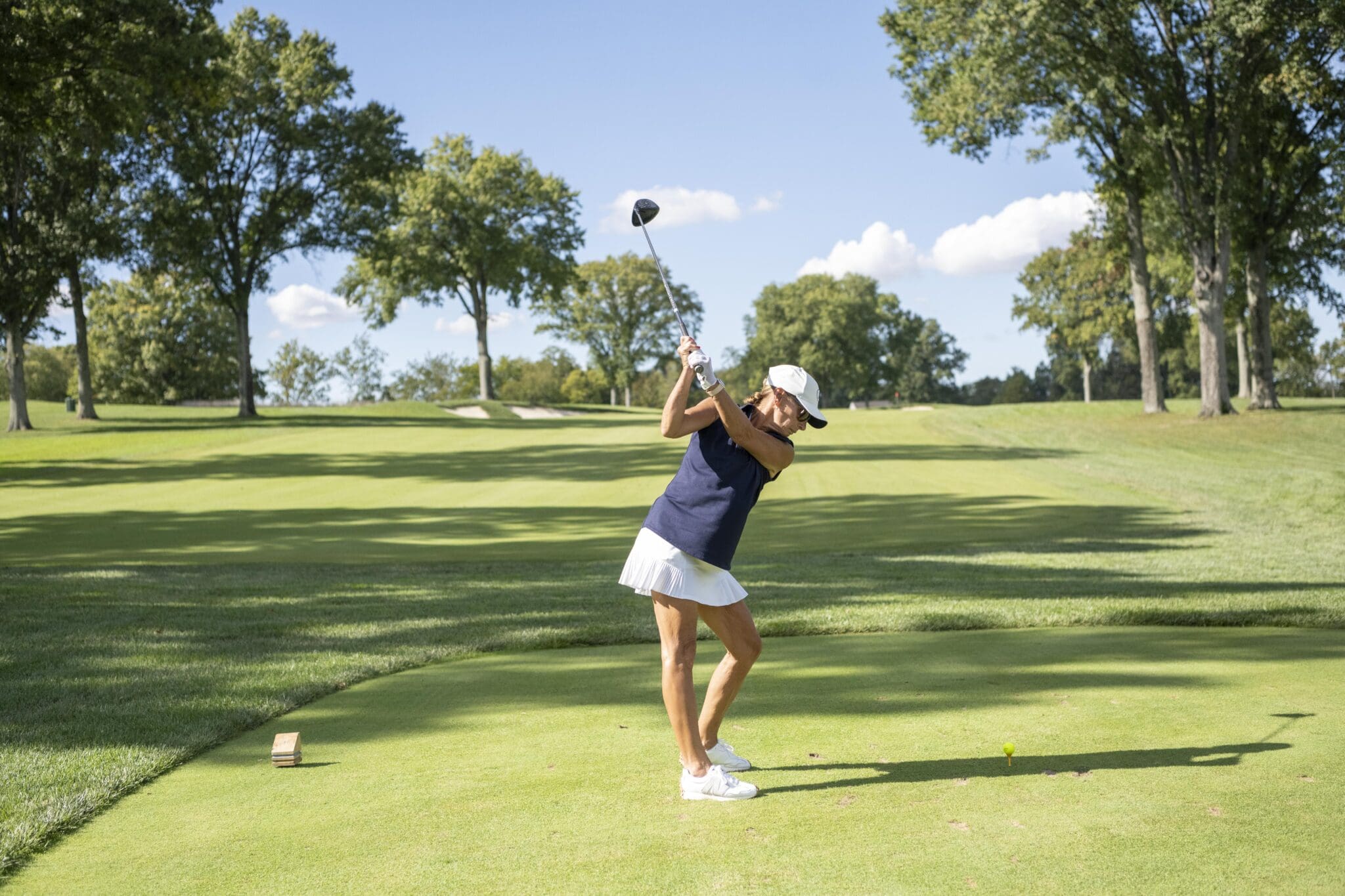 A golfer teeing off at the KAA Golf Classic