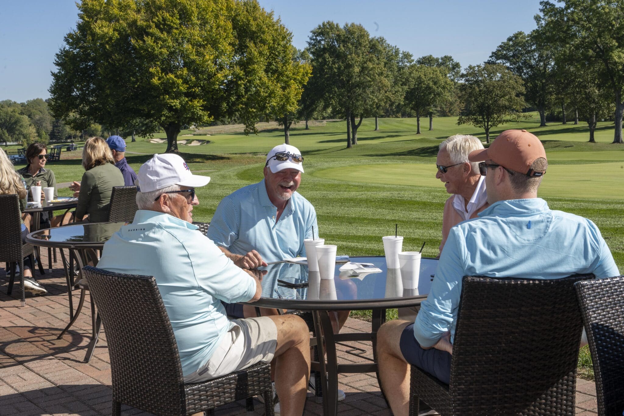 Players laughing and relaxing at the event