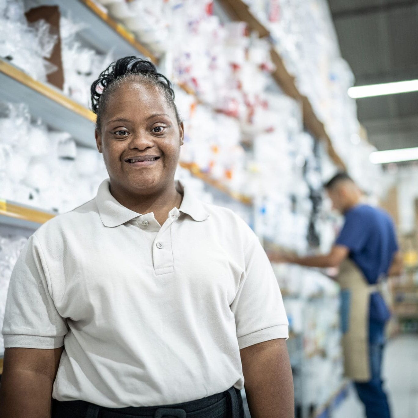 Portrait of a young woman with down syndrome working at the supermarket Portrait of a young woman with down syndrome working at the supermarket